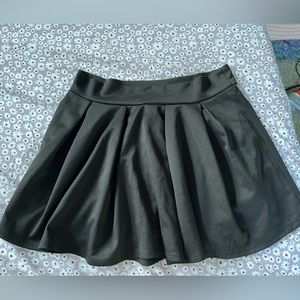 Black ruffled mini skirt